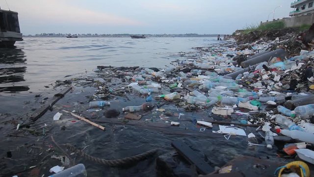 Plastic pollution in sea environmental problem. Plastic bags, bottles, cups and oil pollute the environment