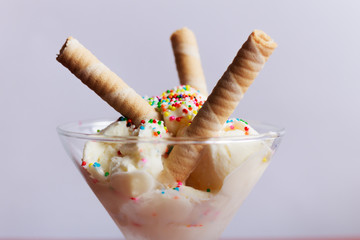 Vanilla and strawberry ice cream served in glasses, with sweet sprinkles and, Bogotá Colombia, February 15, 2017