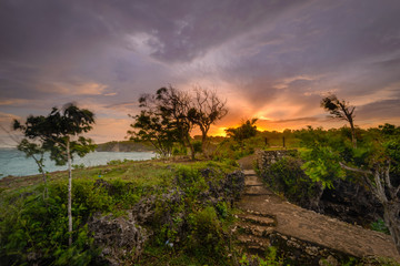 A view of Idian Ocean from Bali, Indonesia. Beautiful blue ocean water and a hanging cliff by the sea