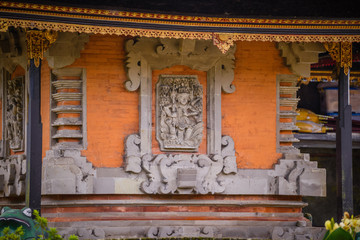 Fototapeta premium Balinese sculptures and traditional architectural details in a temple in Bali, Indonesia