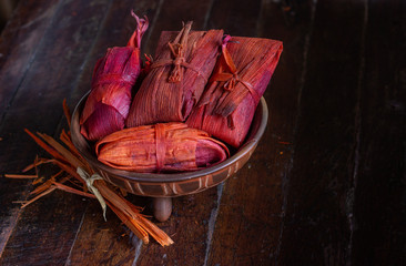 Tamal pisque traditional Nicaraguan food made from dough and wrapped in corncob leaf with natural...