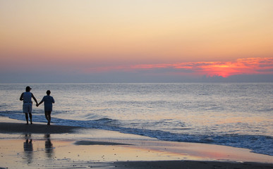 couple on the beach at sunset
