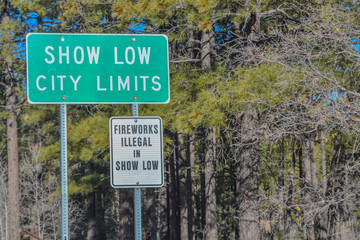 Show Low City Limits Sign and Fireworks Illegal in Show Low Sign. Show Low, Arizona USA.