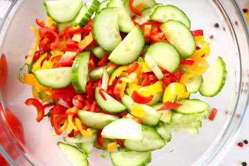 Glass Bowl Holding Vegetable Ingredient Salad. Small Pieces of Fresh Cucumber and Chopped Chili Pepper. Healthy Culinary Recipe. Delicious Vegetarian Dieting Food. Partial View Photography