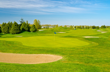 Golf place with gorgeous green and blue sky view
