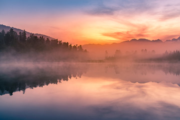 Matheson lake with reflection with beauty sunrise sky  background, New Zealand natural landscape background