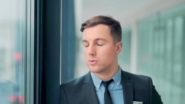 Closeup, Young Man Breathing Deeply Is Calming