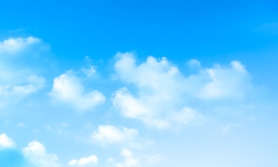 ิblue sky against white floating clouds background