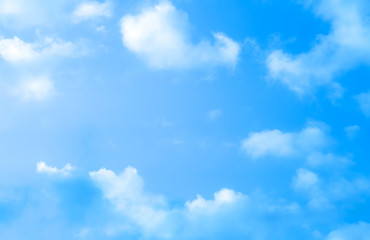 Obraz na płótnie Canvas ิblue sky against white floating clouds background