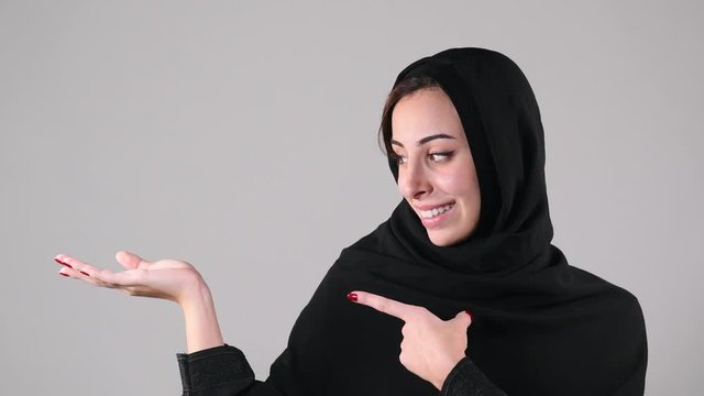Arabian girl brainstorming, Idea Concept, Arabian girl pondering a solution, doubting question.