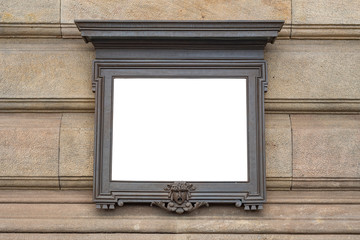 Empty stone tablet with a frame on the wall of an old building