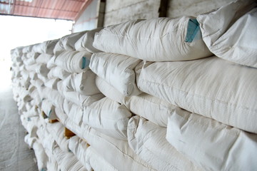 Large bags of grain are ready for further use.