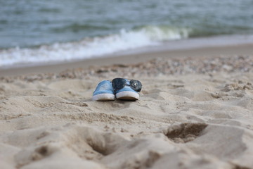 shoes on against the sea