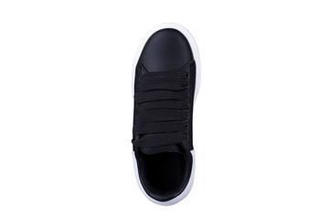 Black sneaker top view with wide laces.