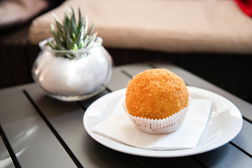 Arancino or arancina, tipical and traditional sicilian street food.  Delicious rice balls made with fried rice.