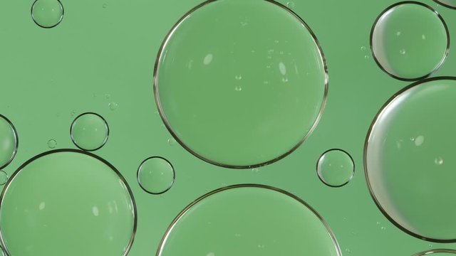 Bubble oil flowing on water surface