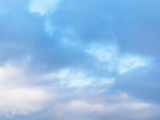 gray snow clouds in blue winter sky