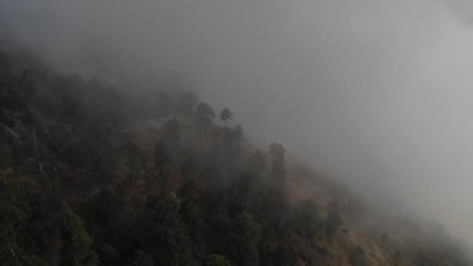 Drone flying through the fog