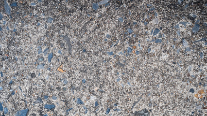 Cement floor with small pieces of stone buried together