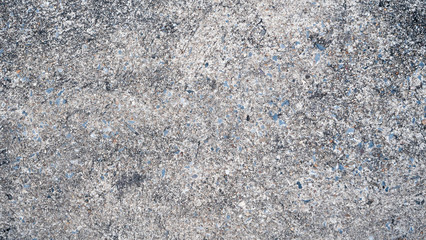 Cement floor with small pieces of stone buried together