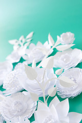 Obraz na płótnie Canvas Hello, spring. With white paper flowers and leaves