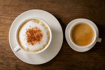 cup of cappuccino and cup of coffee, top view