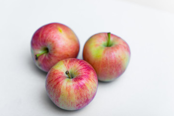 Fresh rustic apple on a white background