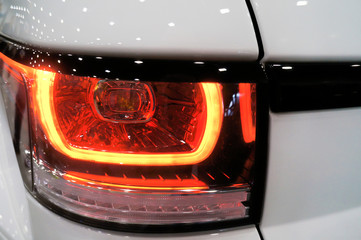 Taillight of a white car close-up - 323384113