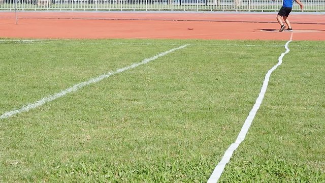 Discus Throw athletes are competing in Discus Throw on the field.
