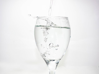 Pour water into the glass until small bubbles of various shapes are formed. White background