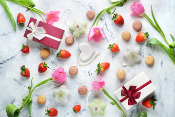 Sweets, strawberries and tulips