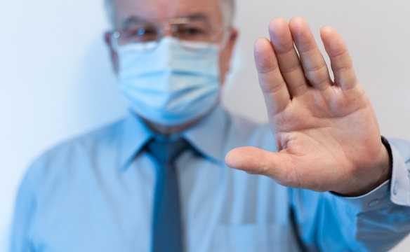 Stop coronavirus, quarantine and Air pollution pm2.5 MERS-Cov Novel 2019 concept. Old man wearing respirator mask for protect with arms outstretched. Wuhan, China epidemic virus symptoms background.