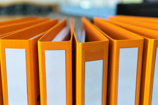 Documents Binder Paper with blank label,Orange Files folder on office desk, Annual Report document for Business papers financial market in offices, lawyer research achieves.Concept work in information