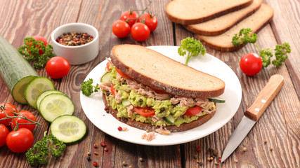 sandwich- bread sliced with tuna, avocado and tomato