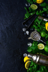 Background with ingredients and props for making summer citrus cocktail. Top view with copy space.