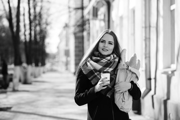 Fototapeta premium Black and white photo of a young girl on a walk