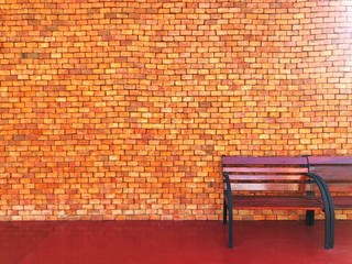 Fototapeta na wymiar red chair on brick wall