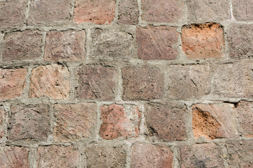 Old brick wall. Coarse texture. Red Brick and cement