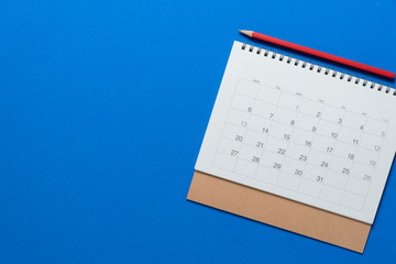 close up of calendar on the blue table, planning for business meeting or travel planning concept © tatomm