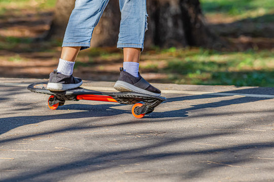 A girl is playing a roller board