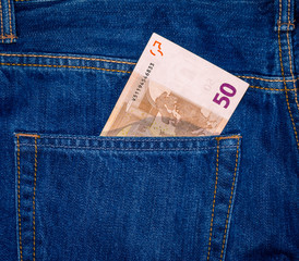 50 euro banknote in the jean pocket.