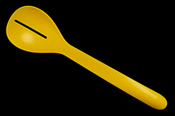 Plastic green spoon on white