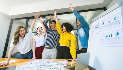 Group of asian young creative happy people entrepreneur on a business meeting office background...