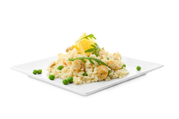 Delicious chicken risotto with lemon slices isolated on white