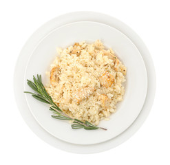 Delicious chicken risotto with rosemary isolated on white, top view
