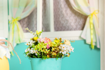 Easter decoration in turquoise and yellow colors.