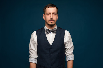 Portrait of young man in formal clothes posing