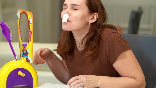 Woman playing a pie in the face
