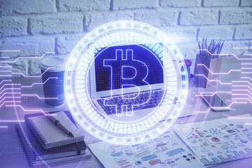 Double exposure of blockchain theme hologram and table with computer background. Concept of bitcoin...