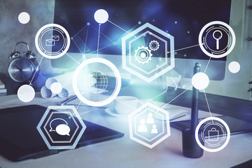 Computer on desktop with social network hologram. Multi exposure. Concept of international people connections.